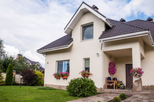 A new house with a garden in a rural area under beautiful sky